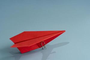 Ambition and goal concept with red paper plane on blue background. 3d rendering. photo