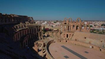 Ruins of Amphitheatre of El Jem with arena columns and brick walls. video