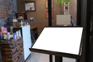 Mock up perspective blank signboard with clipping path, on panel of restaurant, empty space photo