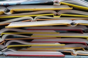 A stack of books lying on a white background, learning, education, study. photo