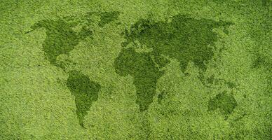 World map on green grass lawn background for global eco-friendly environment, ecological and environmental saving, earth day photo