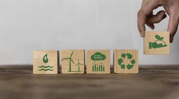 Reduce CO2 or carbon dioxide emissions to limit global warming and climate change, offset by planting tree. photo
