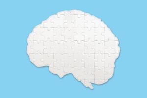 Brain jigsaw puzzles to be placed separately on blue. The concept of treating brain disorders photo