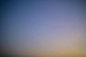 Abstract nature background of romantic pastel sky with silky wispy cloud in golden hour time photo
