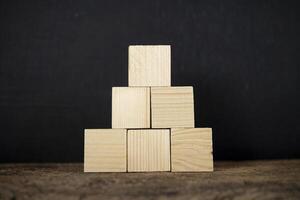 Concept of growth in business,stack of wooden block photo