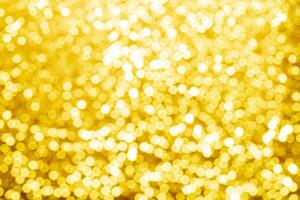 gold abstract background with bokeh defocused lights photo