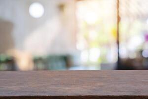 image of wooden table in front of abstract blurred background photo