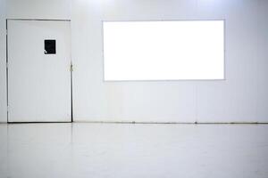 An empty billboard inside a shopping mall that is currently closed for renovations. photo