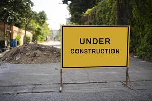 building structure with message under construction. photo
