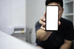 Smart phone with white screen background in toilet, restroom or WC. photo