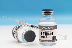 Vaccine and Healthcare Medical concept.Vaccines and syringes on white background photo
