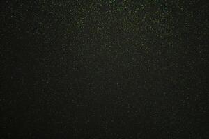 Green sparkling lights festive background with texture. photo