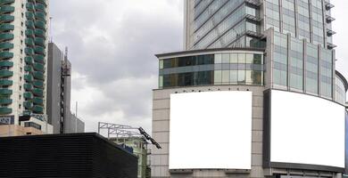 Large blank billboard on a street wall, banners with room to add your own text at Bangkok photo