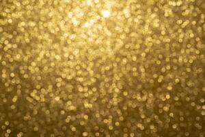 Abstract twinkled bright background with bokeh defocused golden lights photo