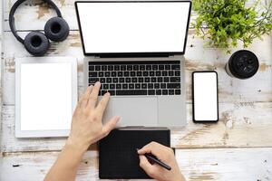 Graphic designer using pen tablet to create digital artwork photo