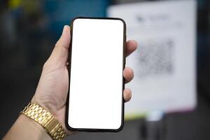 Mockup image of hand holding white mobile phone with blank white screen photo
