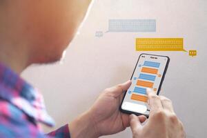 chatbot via mobile smart phone application while working photo