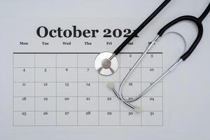 An Image of Calendar And Stethoscope photo
