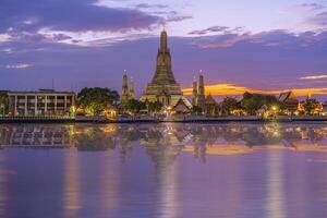 Twilight view of Wat Arun Ratchawararam temple. Beautiful sunset at Chao Phraya river, landmark thailand photo