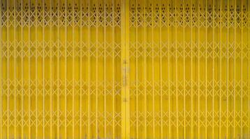 Yellow iron front store gate background photo