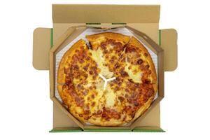 Pizza in a cardboard box against a white background. View from above. Pizza delivery. photo