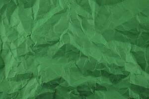 Minimal green crumpled paper texture background for Design photo