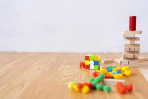 The tower of village blocks in this board game is destroyed on the table photo