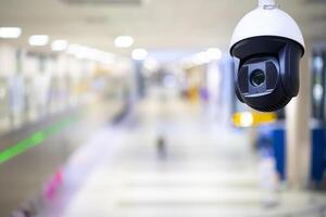 Closed-circuit television,Security CCTV camera or surveillance system in background of Checkpoint - Body and bag Luggage Scan Machine photo