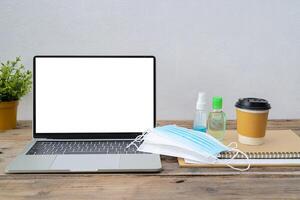 Working from home and remote access concept. Blank laptop computer screen photo