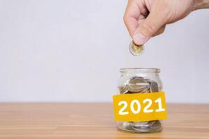 2021 New Year resolution for saving money for future in business or life. photo
