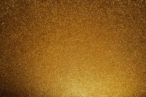 gold Sparkling Lights Festive background with texture. Abstract Christmas twinkled bright bokeh defocused and Falling stars. photo