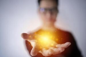 magic particles on the palms of a men, a stream of magical energy emanating from men hands photo