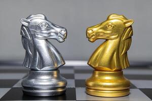 Chess is an strategy and intelligence board game originated in India that is played between two people on a chessboard photo