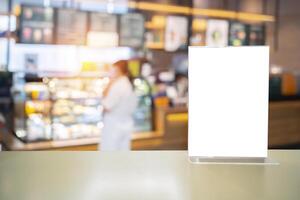 White label on the table. Stand for acrylic tent card Used for Menu Bar and restaurant or put everything into it . mockup photo