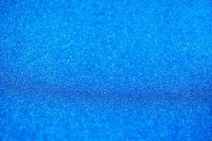 Abstract dark vivid navy blue sparkling glitter wall and floor perspective background studio with blur bokeh.luxury holiday backdrop mock up for display of product.holiday festive greeting card photo