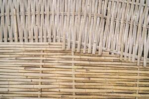 Bamboo sticks wooden background with thread uniting, Alternating arrangement photo