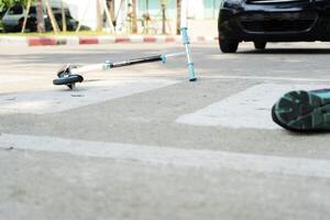 playing a scooter and being hit by a car, While using a crosswalk. photo