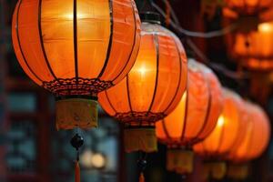 Row of traditional chinese paper lanterns illuminating the night photo