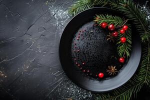 Christmas table setting on black stone background with copy space photo