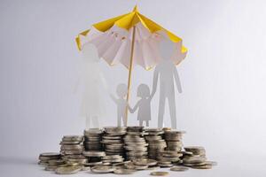 Coin stacks with family with the protect umbrella on dark background , business idea and insurance concept photo