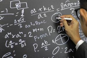 Mathematical concepts. The teacher explained math problems photo