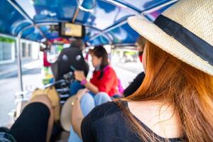 Take a tuk-tuk, which is a symbol of Thailand photo