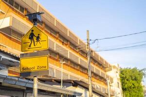 Warning signs indicate the location of the school photo