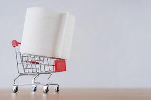 Tissue paper roll is placed on a shopping cart photo