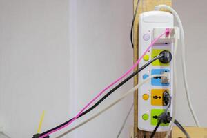 Multiple socket with connected plugs photo
