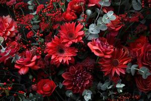 Stunning display of red flowers and berries creating a luxurious, dark background photo