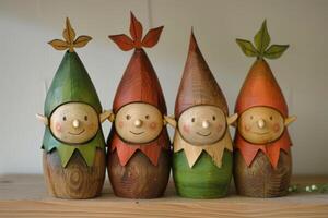 Smiling wooden elf figurines in a row photo
