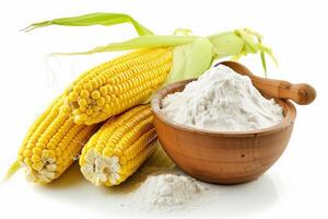 Fresh corn ears and corn flour on white background photo