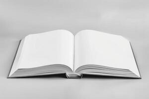 Open book showing blank pages on gray background photo