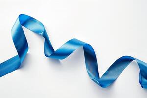 Shiny blue ribbon creating wavy shape on white background photo
